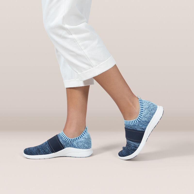 woman wearing blue stretchy knit on foot